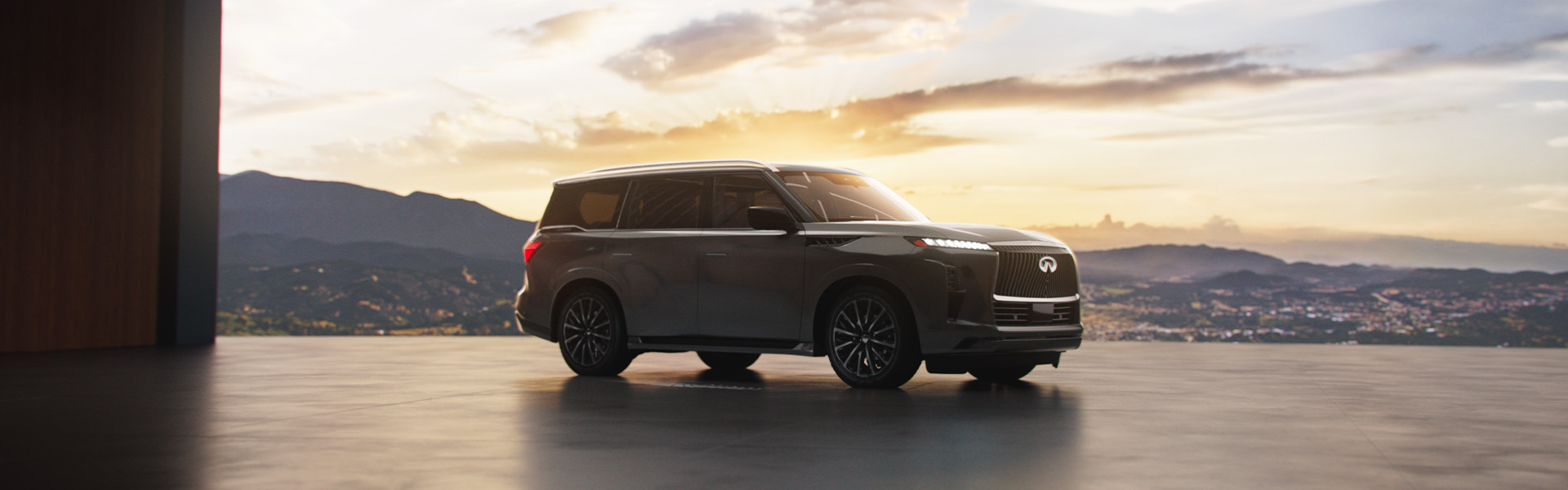 2025 QX80 parked in front of a sunset