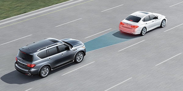 Infiniti driving behind another care displaying adaptive feature