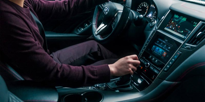 man driving 2023 Infiniti Q50