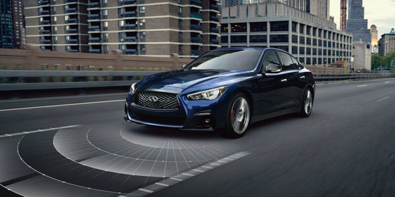 INFINTI Q50 driving showcasing safety technology